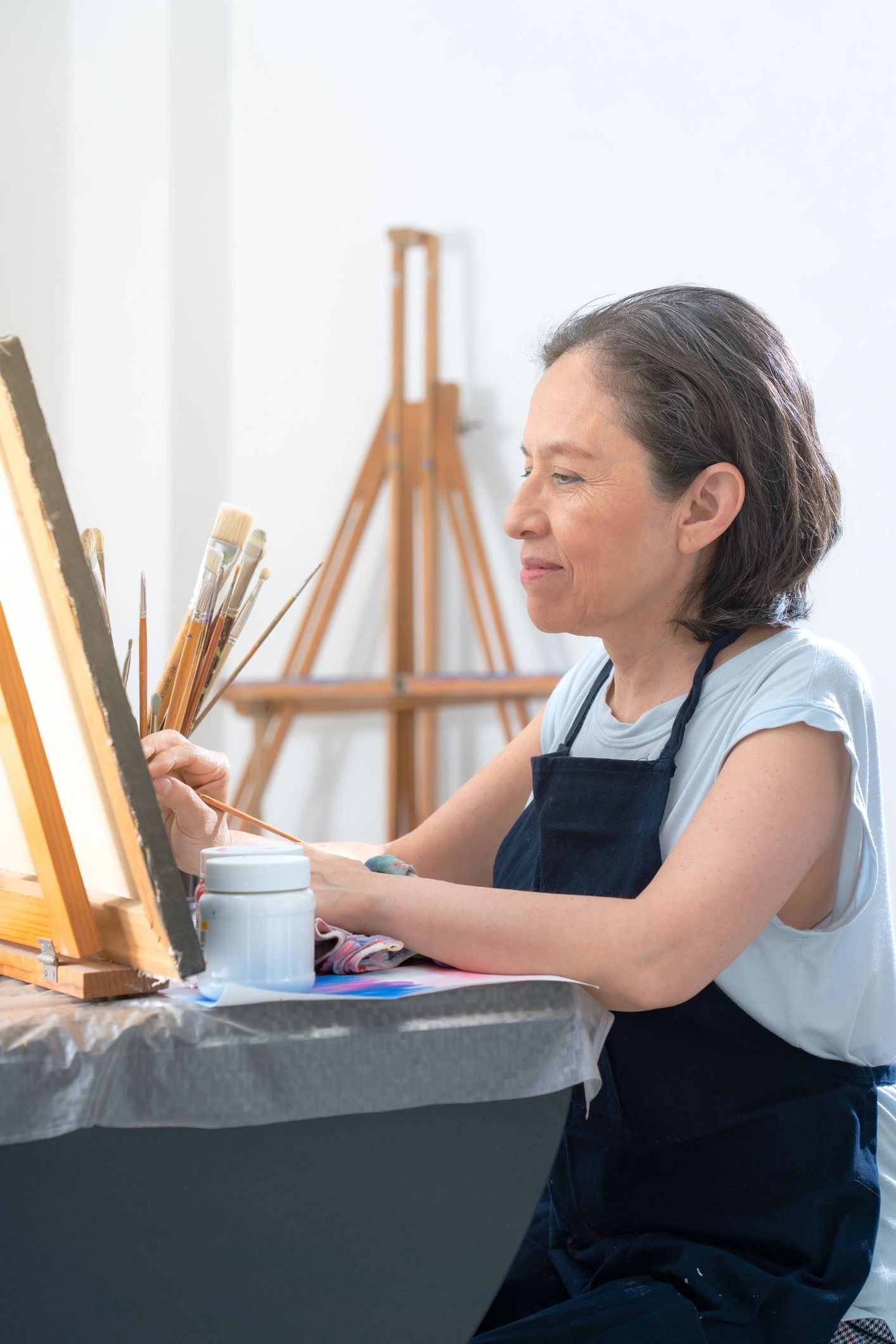 Mature female artist in studio